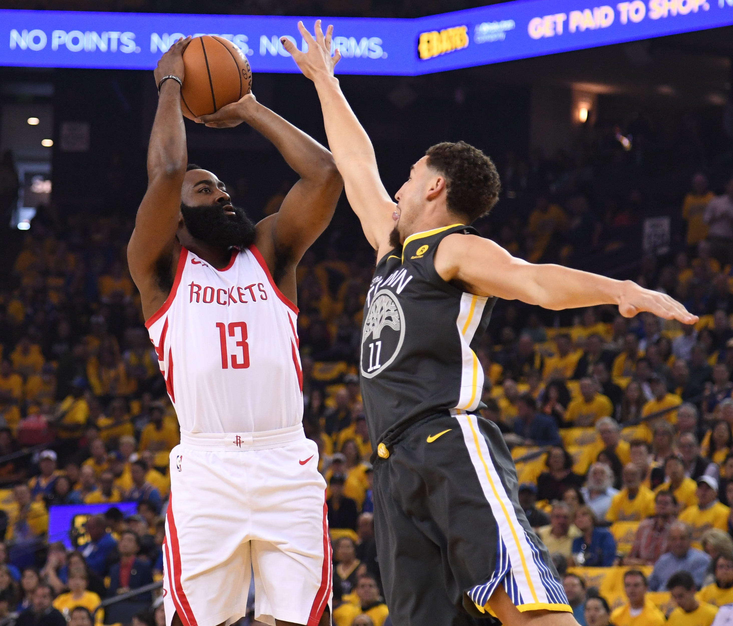 Houston Rockets guard James Harden shoots over Golden State Warriors guard Klay Thompson during the first quarter of Game 4.