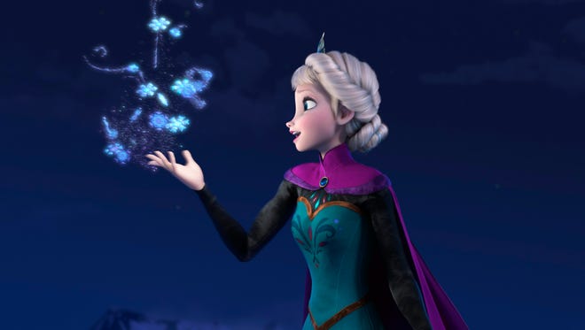 This image released by Disney shows Elsa the Snow Queen, voiced by Idina Menzel, in a scene from the animated feature "Frozen." Disney Theatrical Productions said Friday that the husband-and-wife team of Robert Lopez and Kristen Anderson-Lopez will be working on the stage version of "Frozen" and Jennifer Lee, co-director and screenwriter of the film, is writing the book.  (AP Photo/Disney, File)