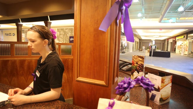 Coping is hard for Shaylynn Duvall of Monroe who knew Bruck. Purple ribbons to support Bruck are everywhere in the area.