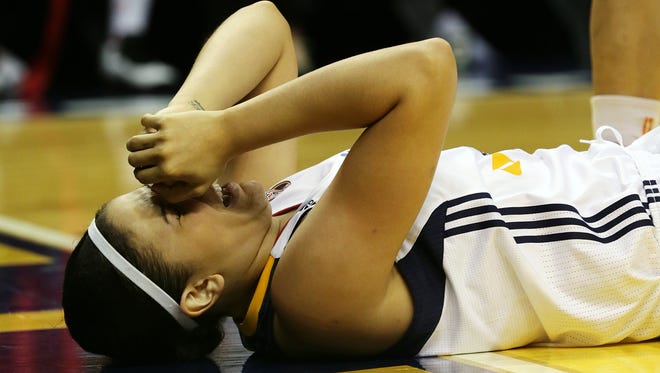 Fever center Natalie Achonwa (11) winces after taking an arm to the nose, resulting in a foul by Sky guard Cappie Pondexter (23), Indiana Fever and Chicago Sky, Sunday, June 14, 2015, at Banker's Life Field House, Indianapolis. The Fever lost, 98-72.