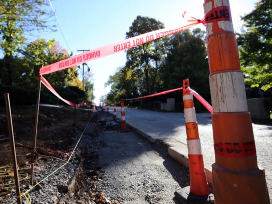 The sidewalk construction site on Gale Lane between