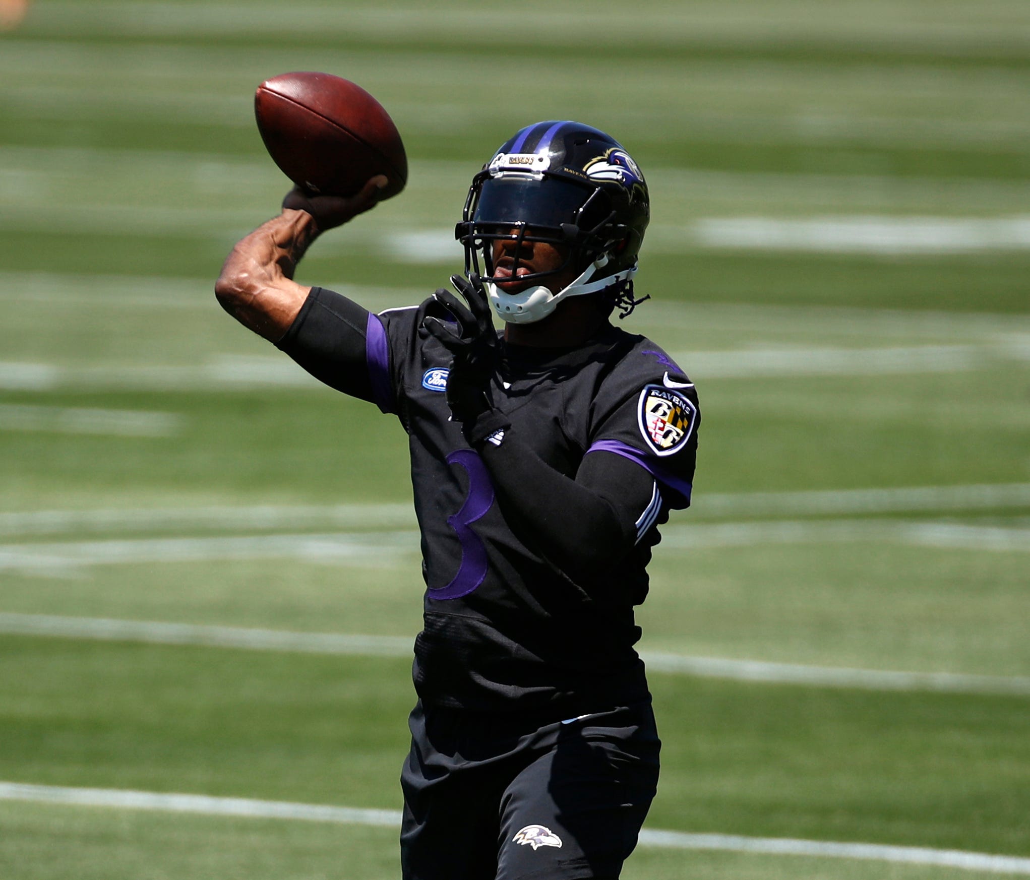 Baltimore Ravens quarterback Robert Griffin III throws a pass during an NFL football organized team activity at the team's headquarters in Owings Mills, Md., Thursday, May 24, 2018.