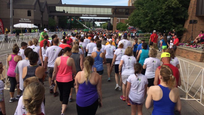 Crowds of runners and walkers head toward the starting line of the Bellin Run 2017 on Saturday, June 10.