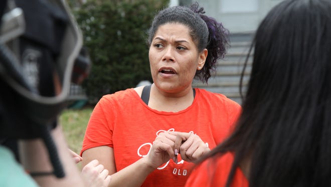 Judge Leticia Astacio talks outside of her house Tuesday afternoon.