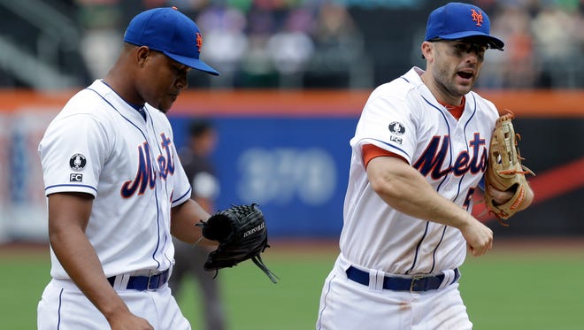 The Mets' David Wright, right, reacts as he comes off the field with relief pitcher Jeurys Familia during the eighth inning against the Marlins at Citi Field on Sunday.