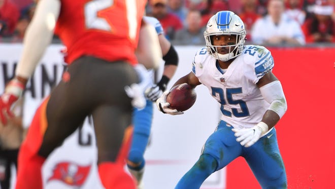 Lions running back Theo Riddick picks up a big gain on the Lions' game-winning drive late in the fourth quarter.
