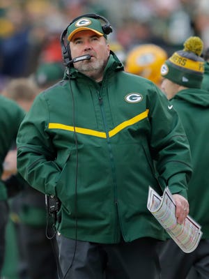 Green Bay Packers coach Mike McCarthy works the sideline during the team's Week 16 game against the Minnesota Vikings at Lambeau Field.