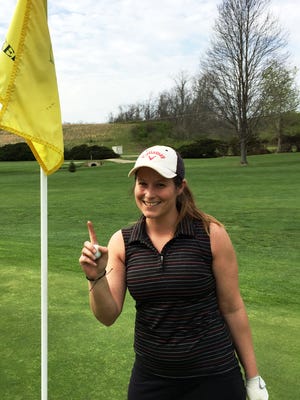 Anne Blackburn, of Zanesville, smiles with the ball she used to hit a hole-in-one on the par-3 16th hole on Thursday at Green Valley. Send your hole-in-one pictures and info to trnews@zanesvilletimesrecorder.com.