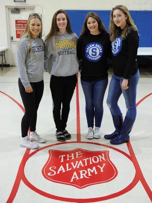 All smiles and ready to help the Plymouth Salvation Army are Salem students (from left) Morgan Overaitis, Hailey DeChalk, Olivia Minehart and Madison Sopha.