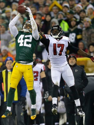 Green Bay Packers' Morgan Burnett intercepts a pass in front of Atlanta Falcons' Devin Hester in the second quarter.
The Green Bay Packers host the Atlanta Falcons Monday, December 8, 2014, at Lambeau Field in Green Bay, Wis.
Wm.Glasheen/P-C Media