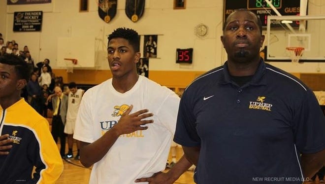 University Preparatory Charter School for Young Men basketball coach James Reaves, right.