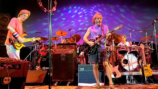 FILE - In this Aug. 3, 2002 file photo, The Grateful Dead, from left, Phil Lesh, Bill Kreutzmann, Bob Weir and Mickey Hart perform during a reunion concert in East Troy, Wis. The group  will perform three shows from July 3-5 at Soldier Field in Chicago. (AP Photo/Morry Gash, File)