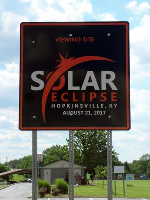 This June 7, 2017 photo shows a sign showcasing a upcoming solar eclipse in Hopkinsville, Ky.  For the first time in 99 years, a total solar eclipse will sweep across the United States on Aug. 21. There is heightened anticipation in the eclipses path, including in the small, rural towns of southwestern Kentucky. (AP Photo/Alex Sanz)