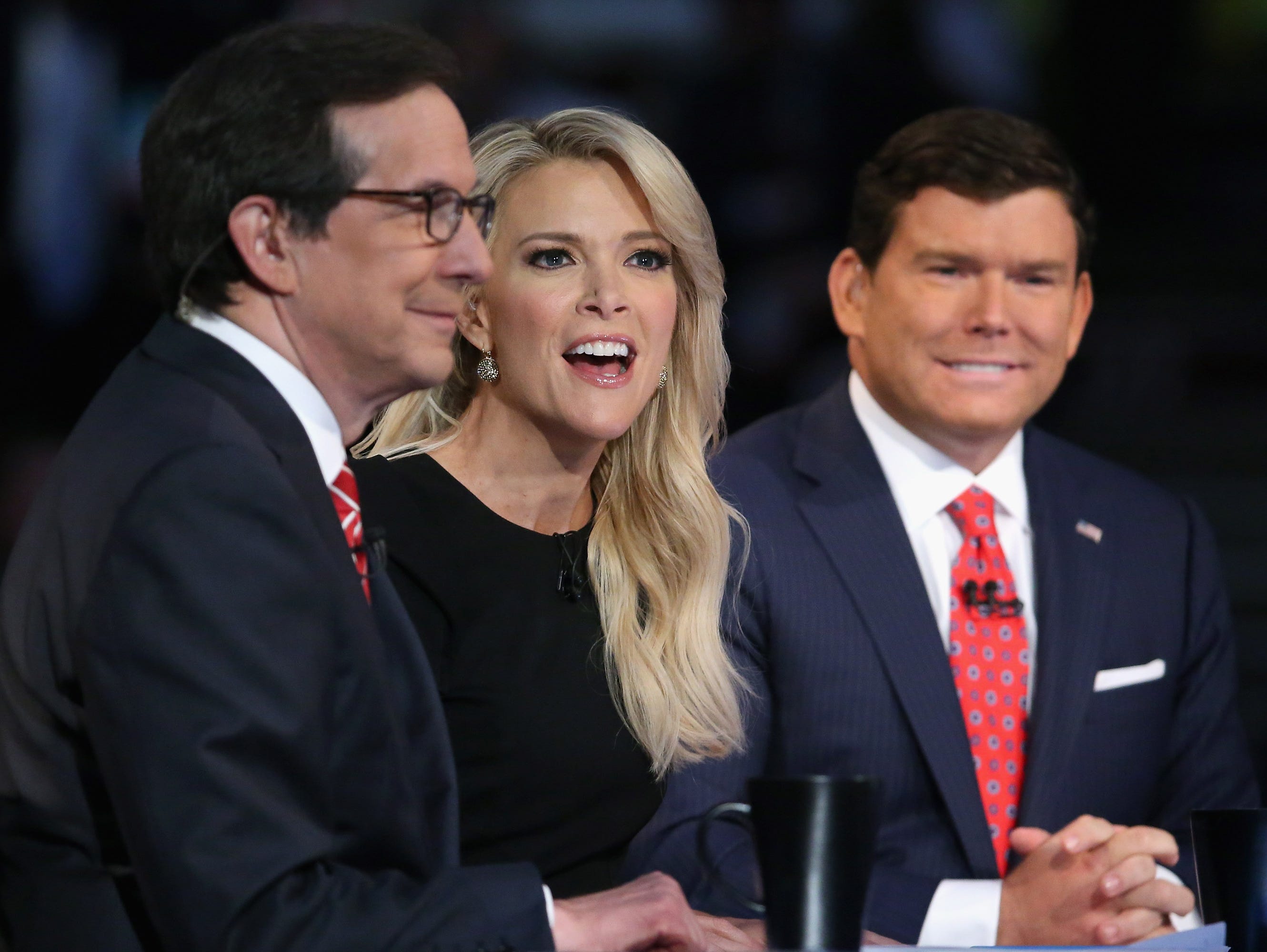 Fox News anchors Chris Wallace, Megyn Kelly and Bret Baier moderate the first prime-time Republican presidential debate at the Quicken Loans Arena August 6, 2015 in Cleveland, Ohio.