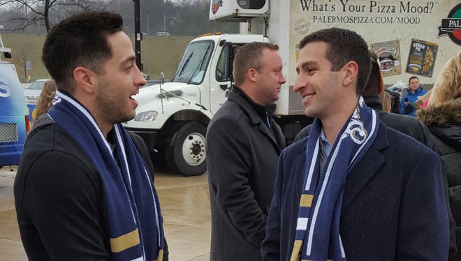 The Brewers' Ryan Braun (left) and GM David Stearns chat Wednesday morning outside Miller Park, where Braun was participating in a Thanksgiving food drive.