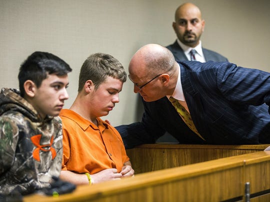 Kyle Anger speaks with his lawyer as Mikadyn Payne,