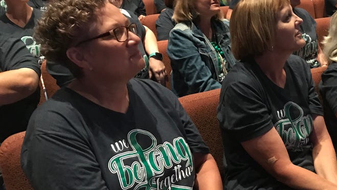 Brenda Keefer, left, of Long Early Learning Center, watches the Abilene Independent School District's convocation at Beltway Park Church with colleague Linda Turner on Thursday, Aug. 17, 2017.