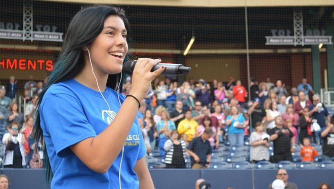 Nayelli Lara, a 15-year-old Boys & Girls Club member from Dayton, singing the National Anthem earlier this month at a Reno Aces game, will perform the National Anthem at Saturday’s Night in the Country Music Festival concert.
