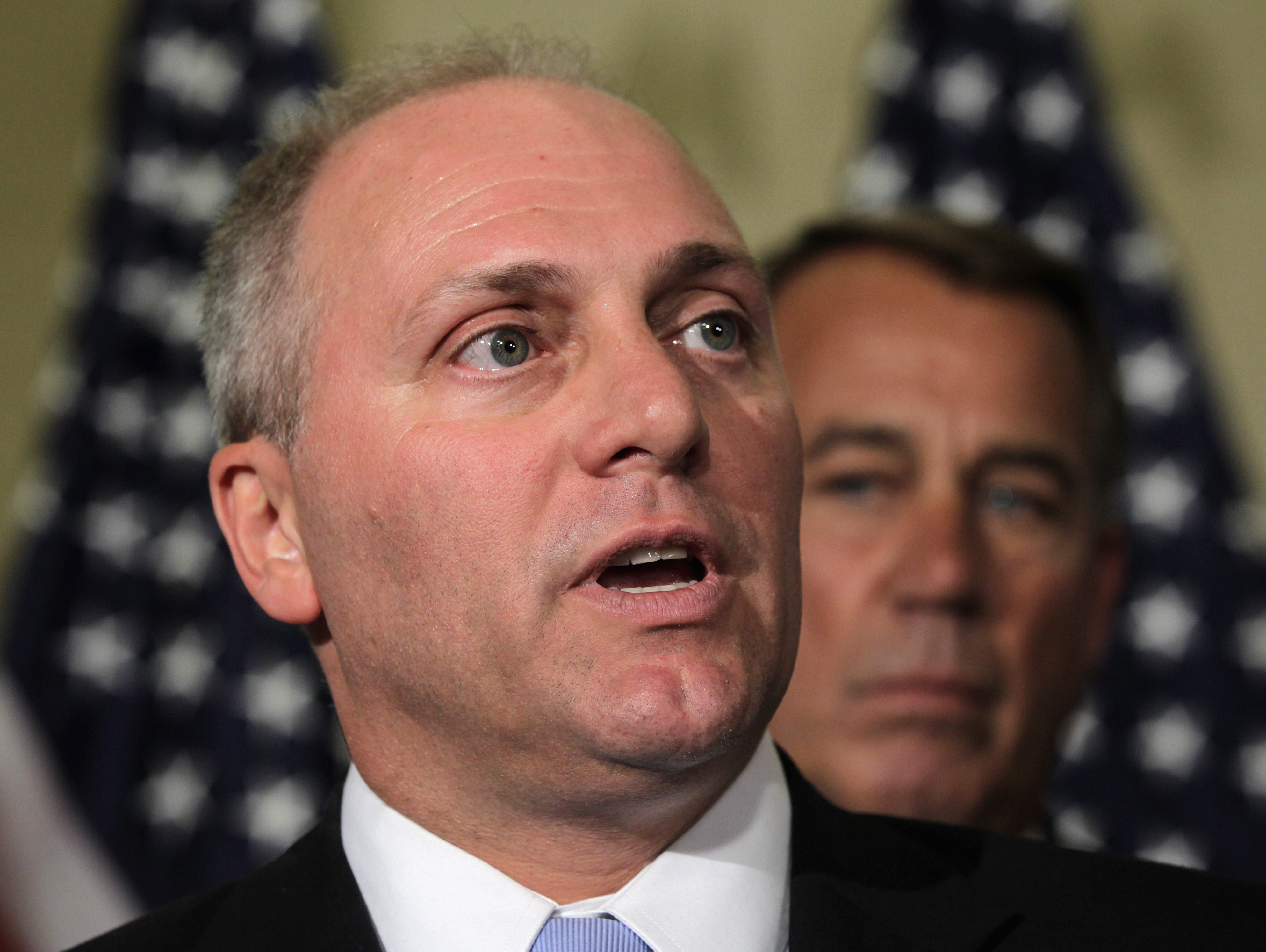 WASHINGTON, DC - JUNE 19:  U.S. Rep. Steve Scalise (R-LA) (L) speaks to members of the media as Speaker of the House Rep. John Boehner (R-OH) (R) listens after a leadership election at a House Republican Conference meeting June 19, 2014 on Capitol Hi