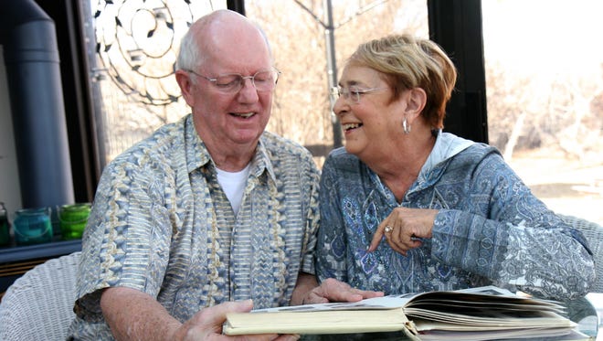Lyle and Virginia Pinsonneault look through their 1960 Great Falls High yearbook. The two were friends all through school, but started dating a couple of years after high school and have been married 51 years.