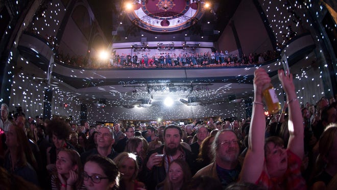 Music fans cheer on the rotating cast of local musicians at last year's Shine A Light concert at World Cafe Live at the Queen in Wilmington last year.