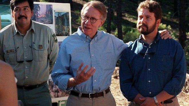 Harry Reid, center, along with Lake Tahoe forest supervisor Juan Palma, left, and Undersecretary of Agriculture Jim Lyons, talk about prescribed burns in 1998.