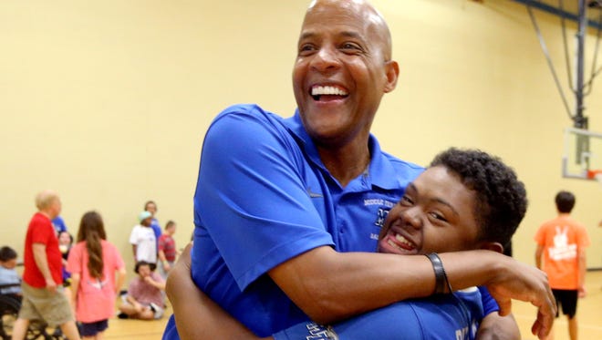 MTSU Men’s assistant basketball coach Win Case gets a hug from, Nick a camper from Camp Ability of Special Kids, on Tuesday, July 25, 2017 during the MTSU Men’s basketball team sponcered clinc, at North Boulevard, in Murfreesboro, Tenn.