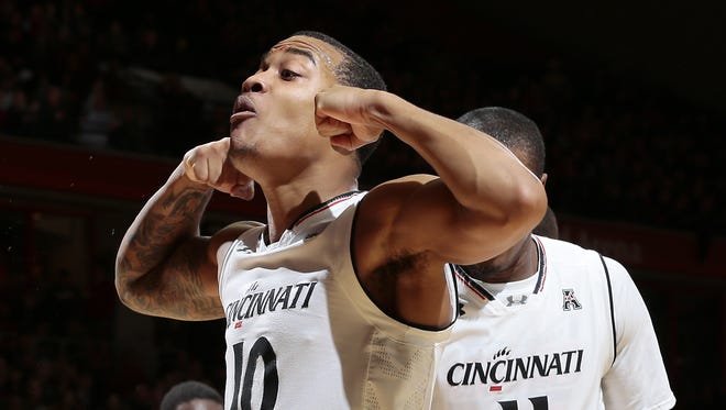 Cincinnati Bearcats guard Troy Caupain (10) flexes to the student section after making a shot and drawing a foul in the second half.