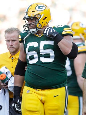 Packers guard Lane Taylor has agreed to a restructured contract.