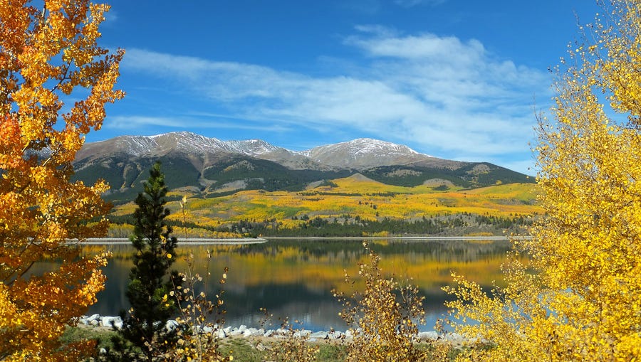 Awesome autumn: A few clouds hover above the Colorado Rockies on a glorious fall morning earlier this week. Mt. Elbert, the highest mountain in Colorado, is in the background.