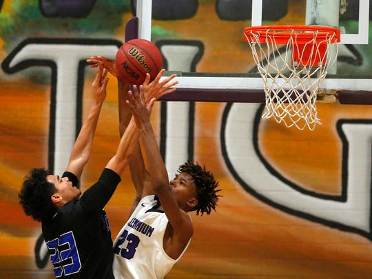 Chandler's Jacquez Barrow (23) goes up for a basket