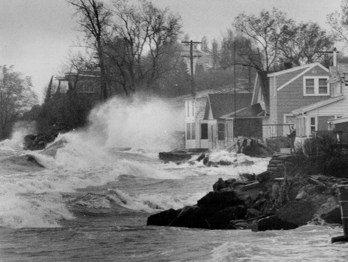 In this 1973 photo, wind pushes waves into homes on