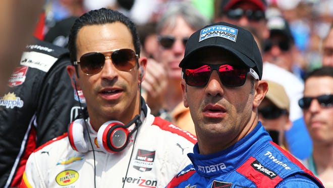 May 24, 2015; Indianapolis, IN, USA; IndyCar Series driver Tony Kanaan (right) and Helio Castroneves during the 2015 Indianapolis 500 at Indianapolis Motor Speedway. Mandatory Credit: Mark J. Rebilas-USA TODAY Sports