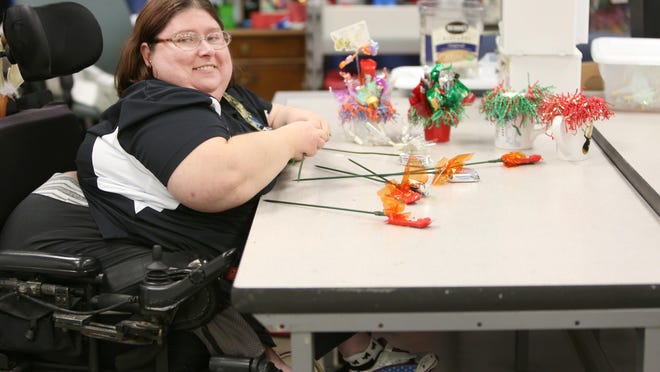 Stacy Whipp, who was born with spina bifida, currently works at Production Services Unlimited in Lebanon. It's a non-profit business owned by the Warren County Board of Developmental Disabilities. Eugene B. Rose, a former president of the board, praises an Enquirer story about Whipp and others because it humanized those with disabilities.