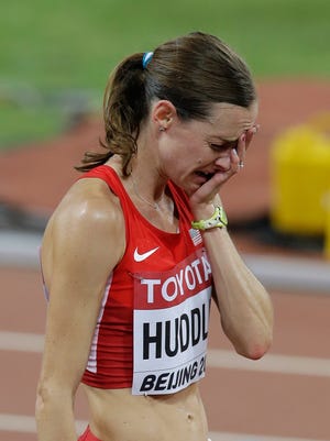 United States' Molly Huddle reacts after the women’s 10,000m final at the World Athletics Championships at the Bird's Nest stadium in Beijing, Monday, Aug. 24, 2015. (AP Photo/Darron Cummings) 