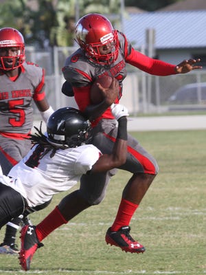 South Fort Myers' Riley Ware attempts to stop North Fort Myers' Zaquandre White during a pre-season game at North Fort Myers HIgh School on Thursday.