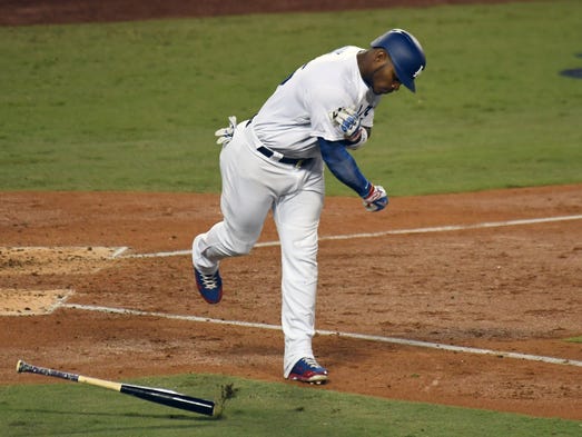 Game 7 at Dodger Stadium: Yasiel Puig spikes his bat