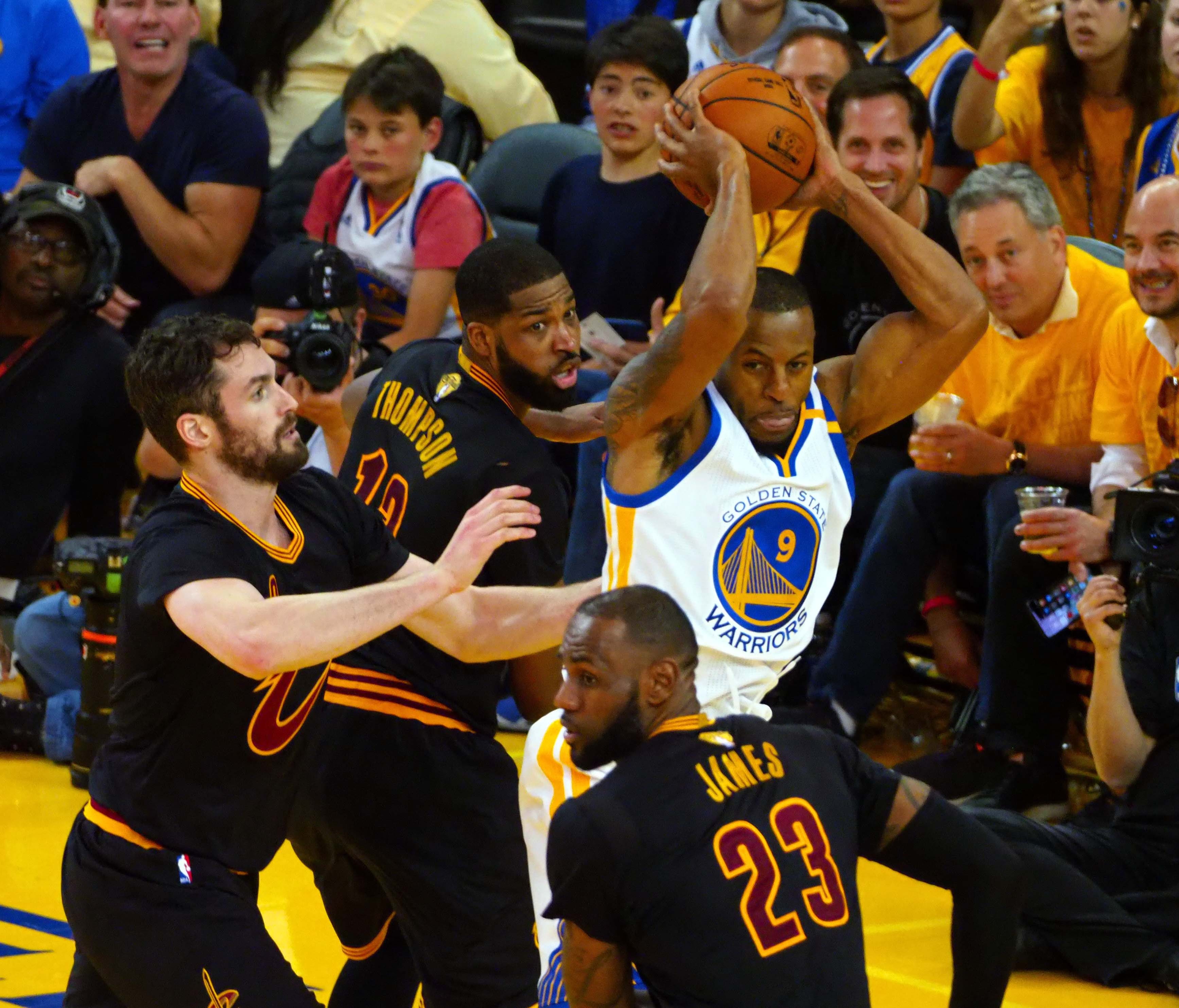 Golden State Warriors forward Andre Iguodala (9) handles the ball against Cleveland Cavaliers forward LeBron James (23) during the third quarter in game five of the 2017 NBA Finals at Oracle Arena.