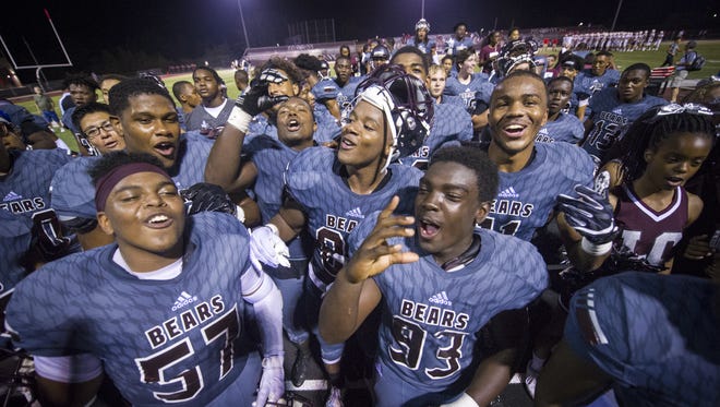 Lawrence Central players sing their school's song for the fans after winning Sept. 22.