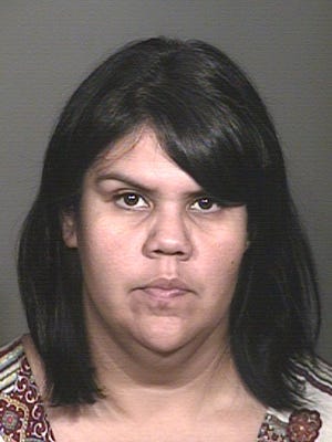 Mesa police arrested Jennifer Enriquez in October 2014 because investigators believe she embezzled more than $13,000 from a Chevrolet dealership.