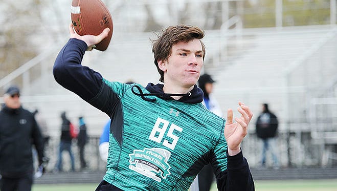 After throwing two interceptions through a forgettable three quarters Thursday night, Divine Child (Dearborn) and future Michigan State quarterback, Theo Day, led the Falcons to a 20-17 comeback road victory over the East Lansing Trojans.