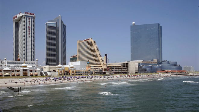 In this Wednesday, July 23, 2014 file photo, the Revel Casino Hotel, right, stands Trump Taj Mahal Casino, left, with its Chairman Tower, and the Showboat Casino Hotel, second right, are seen in Atlantic City, N.J. As Revel, Showboat and Trump Plaza prepare to shut down over the next few weeks, putting thousands of employees out of work,  Atlantic City is planning additional job training. Mayor Don Guardian said Tuesday, Aug. 26, 2014, that an effort to provide employment training and identify opportunities for unemployed workers will begin by October. It will be funded by the Casino Reinvestment Development Authority, and is designed to help 1,200 workers a year. (AP Photo/Mel Evans,file)