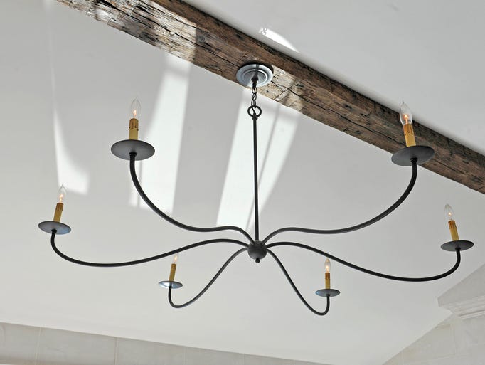 The iron light fixture is from Currey & Company.