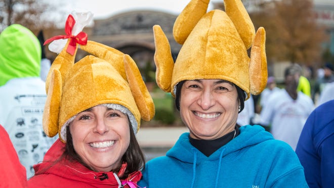 Kristi Draper and Janice Yoste show off their Thanksgiving Day spirit.