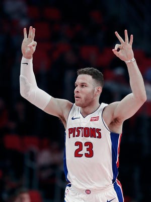 Pistons forward Blake Griffin signals after making a 3-pointer against the Trail Blazers on Monday.