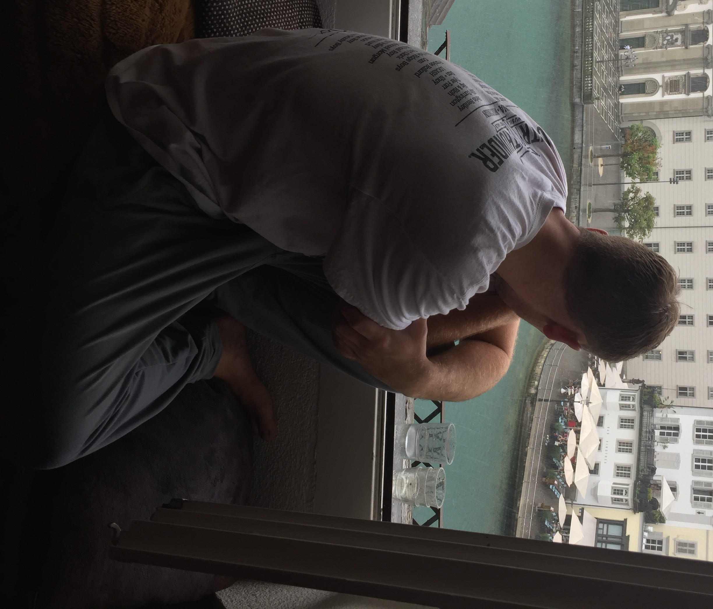 Jack Gilbertson, Dawn's son, takes in the view of Lucerne, Switzerland, from the window nook of their Airbnb rental.