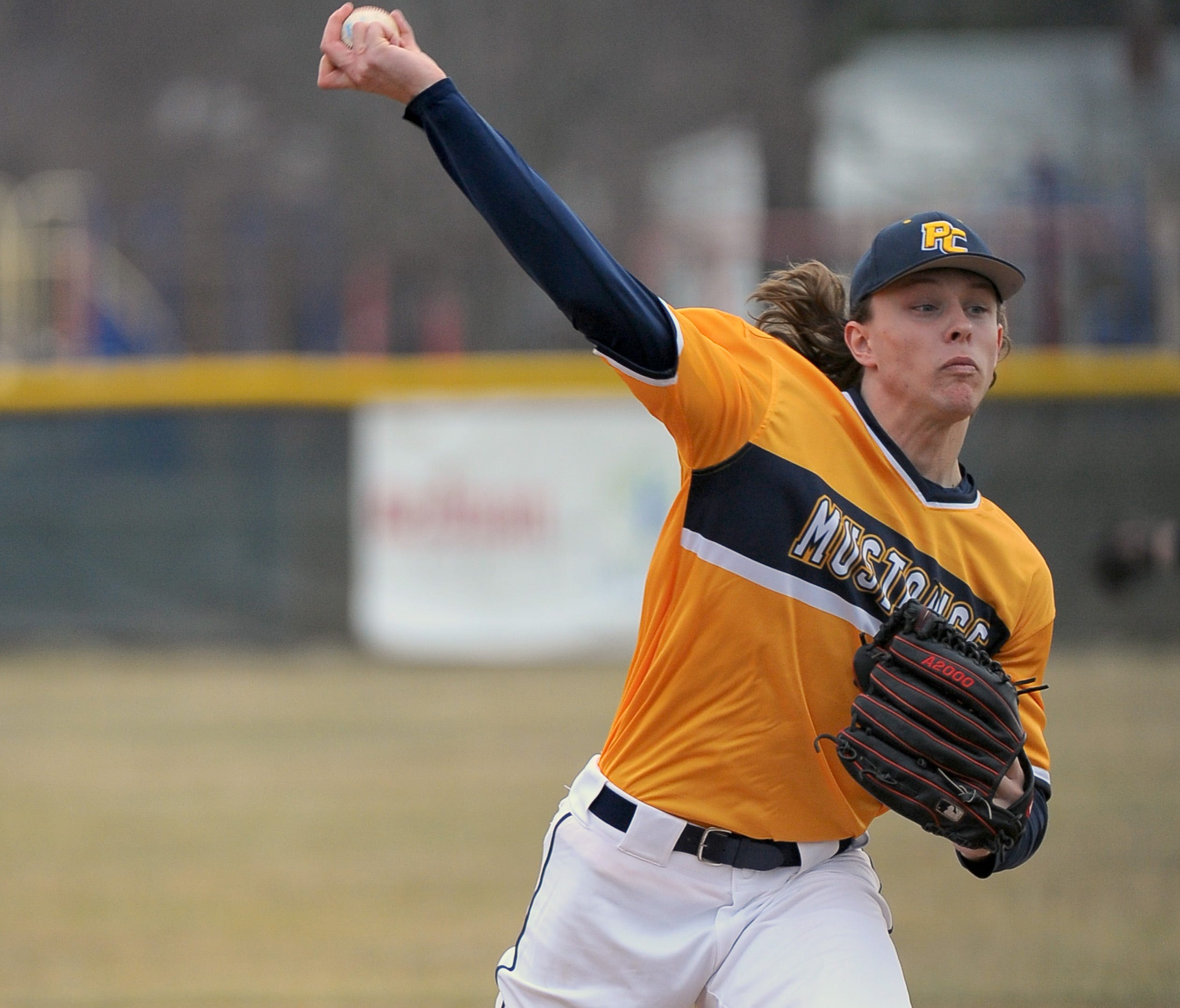 Portage Central freshman Luke Leto fires in a pitch during the Mustangs' home opener against Mattawan.  Leto has been ranked in the top five nationally for Class of 2021.