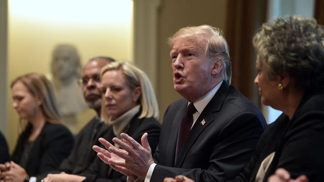 President Donald Trump, second from right, speaks in the Cabinet Room of the White House in Washington, Wednesday, Jan. 23, 2019, as he hosts a roundtable with conservative leaders to discuss the security and humanitarian crisis at the southern border. Homeland Security Secretary Kirstjen Nielsen is third from left. (AP Photo/Susan Walsh)