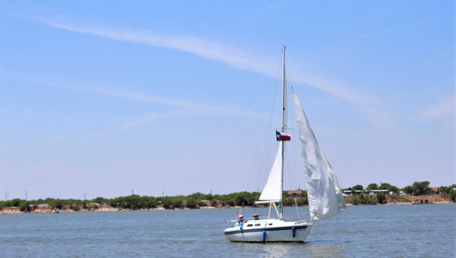 A sailboard cruises across Lake Fort Phantom Hill in June. The lake's level has dropped, though not yet affecting recreation. Abilene is more than 3 inches under its normal precipitation halfway through 2018.