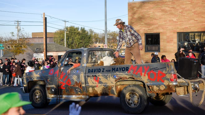 Mayoral candidate David Zokaites stands on his float during the Zombie Walk on Saturday, Oct. 28, 2017. 